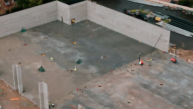 Aerial view of residential and commercial construction site, pour floor 