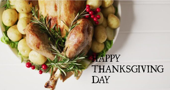 Animation of happy thanksgiving day over dinner on white background