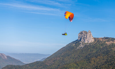 Paragliders above Lake Annecy, in autumn, in Haute Savoie, France