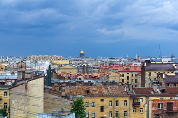 Fototapeta na wymiar top view of the city roofs in the historical center of Saint Petersburg before the onset of a thunderstorm