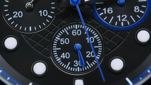Close Up Of Stylish Luxury Man Wrist Watch With Moving Hand And Multiple Dials. Men's Swiss chronograph watch in metal with sapphire crystal. closeup view of rotating watch , running second arrow