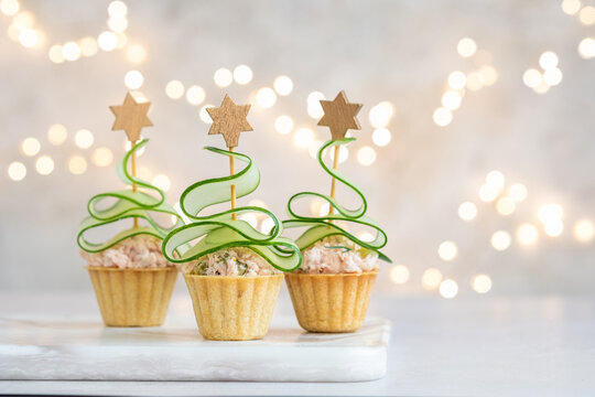 Christmas tree canape with cucumber slice and salmon pate