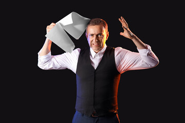 Mature actor with film script on dark background