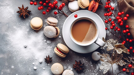 Cup of tea, star anise, holly berry branch and macaron cookies. Christmas background with copy space. Flat lay, top view.