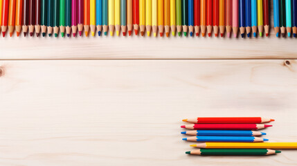 Obraz premium Top view colored pencils on a wooden background, Back to school, Stationery, School supplies frame, Art education, Copy space. Generative AI