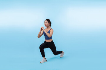 Fototapeta na wymiar Young attractive asian woman in sportswear stretching before fitness exercise routine. Healthy body care workout with athletic woman warming up on studio shot isolated background. Vigorous