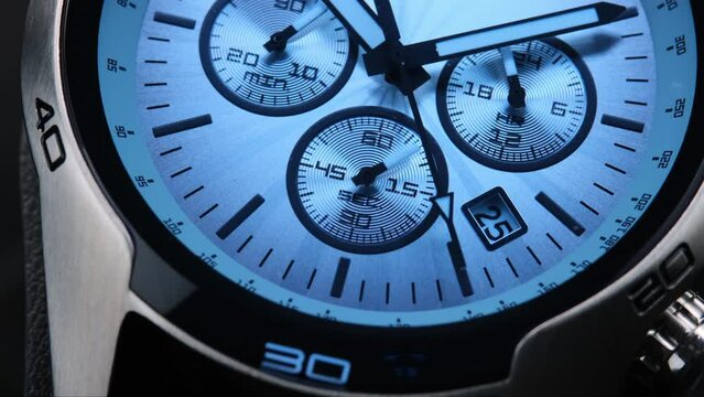 Close Up Of Stylish Luxury Man Wrist Watch With Moving Hand And Multiple Dials. Men's Swiss chronograph watch in metal with sapphire crystal. closeup view of rotating watch , running second arrow