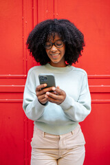 Portrait of african-american girl with smartphone