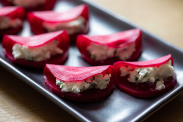 Christmas canapes with pickled beetroot and goat cheese