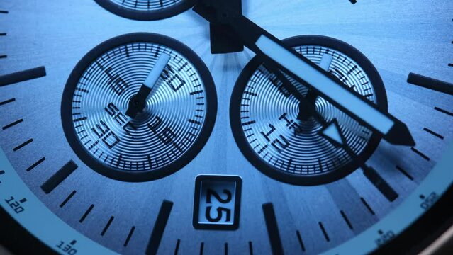 Close Up Of Stylish Luxury Man Wrist Watch With Moving Hand And Multiple Dials. Men's Swiss chronograph watch in metal with sapphire crystal. closeup view of rotating watch , running second arrow