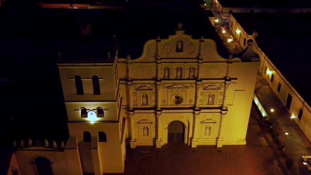 Aerial dolly shot over the facade of the Cathedral of Comayagua during night