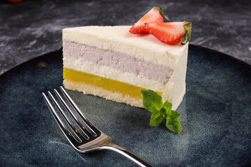 cheesecake cake with strawberries on a dark background.