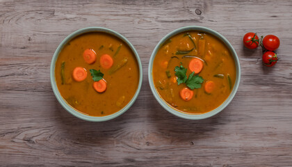 Appetizing soup on the table.View from the above with wooden background. Copy Space