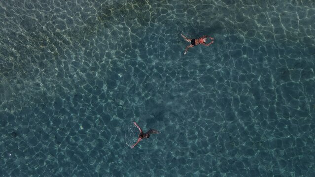 Aerial drone view parga greece, beach crowded with tourists in vacation on summer in famous greek caribbean parga town epirus preveza