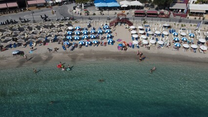 Aerial drone view parga greece, beach crowded with tourists in vacation on summer in famous greek...