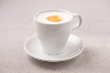 Latte cup isolated on gray background. White cup. Brazilian coffee.
