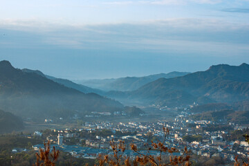 Wuyishan, Wuyishan City, Fujian Province - Aerial view of cityscape and mountains