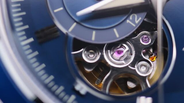 gear drive motion in skeleton watch. Mechanical watches with gears and cogs. Watch or clock mechanism. Clockwork details and parts. Inside watch, mechanical watch in macro view. Macro Clock Face.