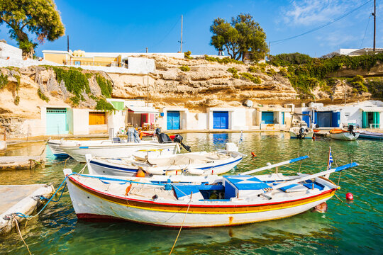 Colorful fishing boats on azure sea water in Mandrakia port, Cyclades, Milos island, Greece