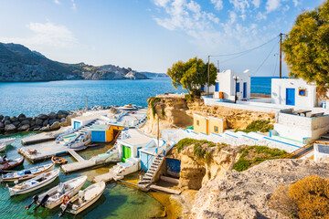 Fishing boats and colorful fishemen houses in Mandrakia port, Cyclades, Milos island, Greece - obrazy, fototapety, plakaty