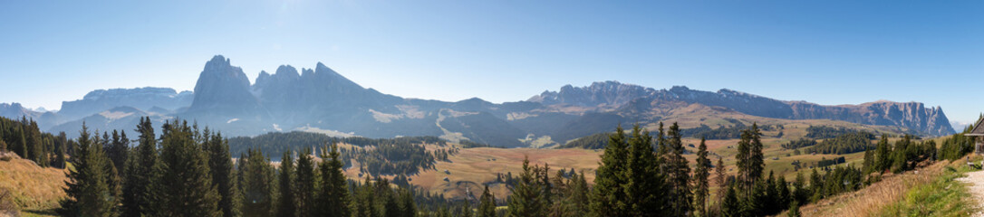 Scenic view of iconic mountain panorama at Seiser Alm Alpe di Siusi with Sassolungo - Langkofel mountain group and Schlern, Dolomites, South Tyrol, Italy