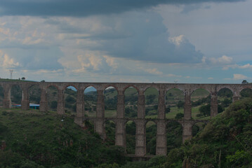 View of arches of ancient aqueduct with three levels