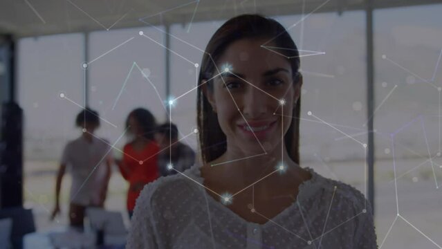 Animation of network of connections against portrait of biracial woman smiling at office