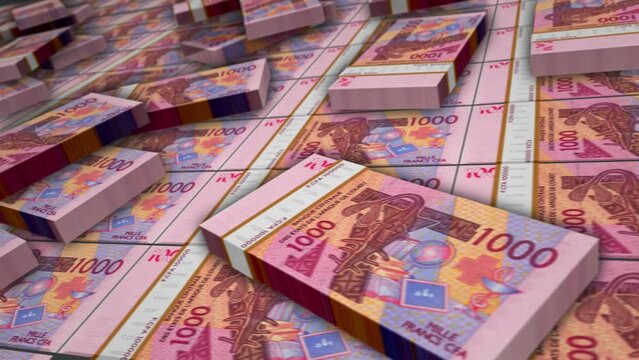 West African money West Africani CFA Franc banknote bundle loop. 1000 XOF money stacks. Concept of business, economy, banking and finance. Camera over cash packs. Loopable seamless 3d.