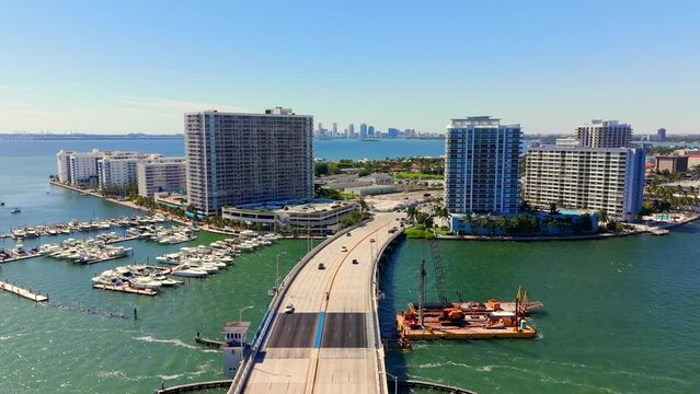 Aerial stock footage Treasure Island Miami Beach downtown in far distance