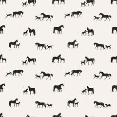 Horses with their foals on a walk, seamless vector pattern