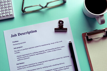 There is a desk there with dummy documents about Job Description.