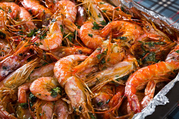 Dish of Mediterranean cuisine – baked in oven tiger shrimps with herbs