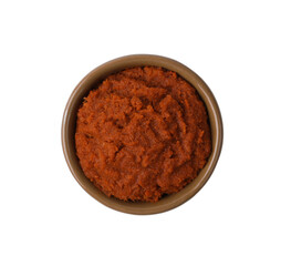 Tasty curry paste in bowl isolated on white, top view