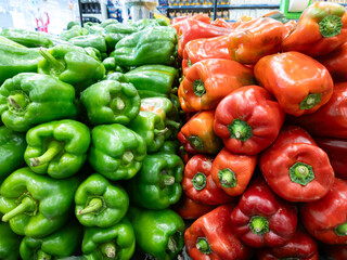 green and red peppers for sale in the market