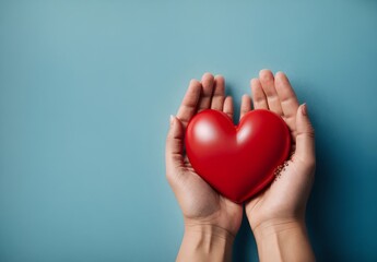 Red heart in hands on a blue background