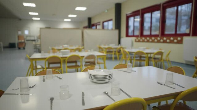 Children's school canteen being prepared to serve. Cinematic shot. 
