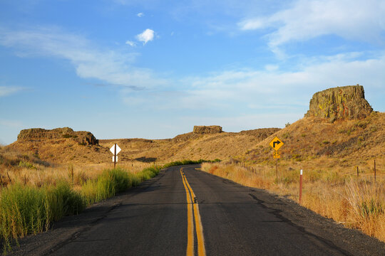 road curving through rugged western scenery