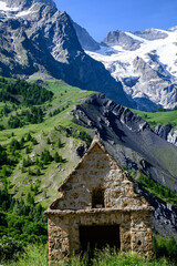 Fototapeta na wymiar La Grave, village in Hautes-Alpes department in southeastern France, small ski resort with off-piste for extreme skiers in French Alps, dominated by mountain peak La Meije in summer