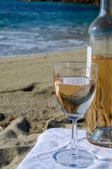 Summer time in Provence, two glasses of cold rose wine on Pampelonne sandy beach near Saint-Tropez...