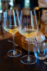 Tasting of Bordeaux white wine in Sauternes, left bank of Gironde Estuary, France. Glasses of white sweet French wine.