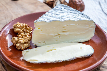 Piece of cheese tomme de chevre made from goat milk in France