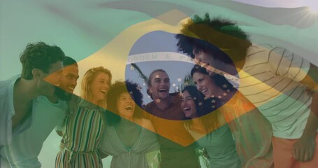 Animation of flag of brazil over smiling diverse friends standing and forming human chain at beach - Powered by Adobe