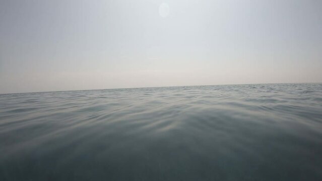 surface of transparent blue water in the swimming pool with blue sky and white cloud, 4K motion scene