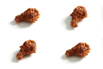 Set of fried chicken drumettes with sauce in Korean style isolated in white background