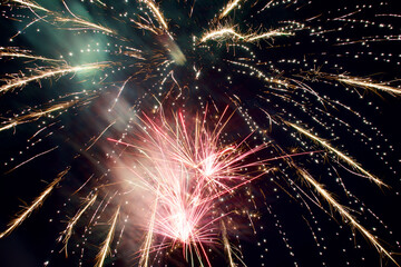 display of multiple color fireworks exploding