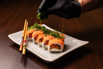 Photo of sushi dish and preparation of sushi for consumption and menu