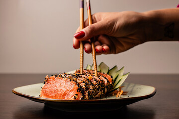 Photo of sushi dish and preparation of sushi for consumption and menu