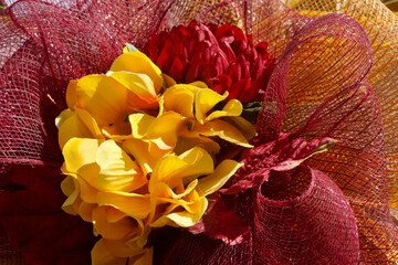 orange and red flower and bow decoration