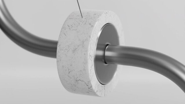A grey tube and a ring on a string in a satisfying 3d animation