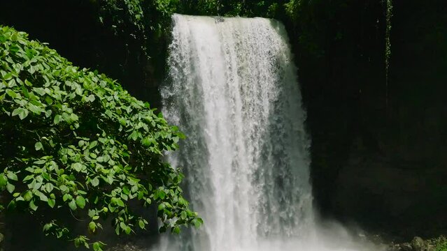 Cold water stream in slow motion view. Hikong Alo Falls. Lake Sebu. Mindanao, Philippines.